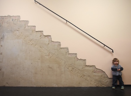 baby standing at the bottom of imaginary stairs