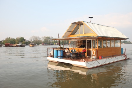 BELGRADE, SERBIA - APRIL 17 : Belgradians enjoying a weekend lunch on their private house boat on April 17, 2010. Houseboats are a common leisurely activity in this city.のeditorial素材
