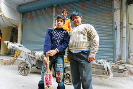 Delhi - January 27: Group of friends with cricket bat on January 27th, 2008 in Delhi, India.のeditorial素材