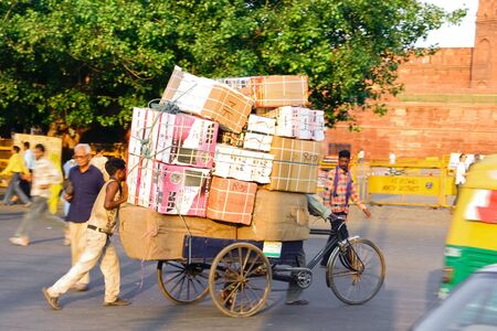 DELHI - SEPTEMBER 22: Cycle rickshaw transporting packages through city on September 22nd, 2007 in Delhi, India. Human labor is still cheaper than motorised vehicles.のeditorial素材