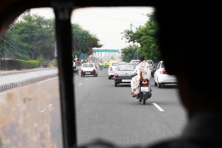 DELHI - SEPTEMBER 15:  View of busy road from rickshaw on September 15, 2007 in Delhi, India. India is building a brand new road network countrywideのeditorial素材