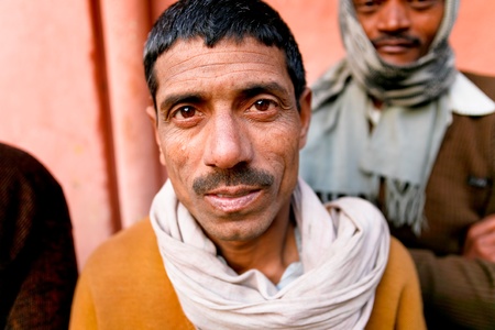 DELHI - JANUARY 31: Portrait of a day labourer January 31, 2008 in Delhi, India. These men sit on the street hoping to get day jobs not paid more than 2,5 dollars a day.のeditorial素材
