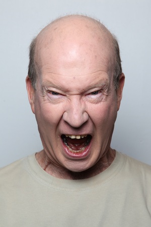 Angry man showing his teethの写真素材