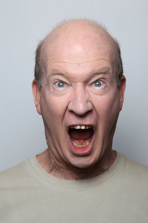 Angry man showing his teethの写真素材