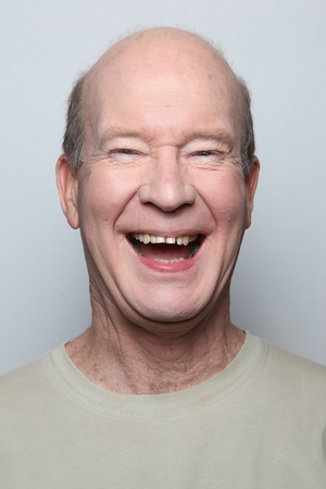 Man making funny face showing teethの写真素材