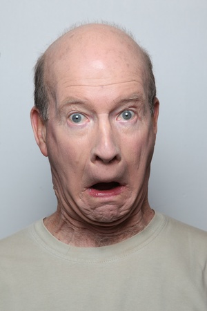 Man making surprised funny faceの写真素材