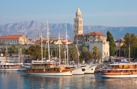SPLIT - SEPTEMBER 24: Boats in harbour and bell tower on September 24, 2011 in Split, Croatia. The bell tower was originally built in 1100 AD.のeditorial素材
