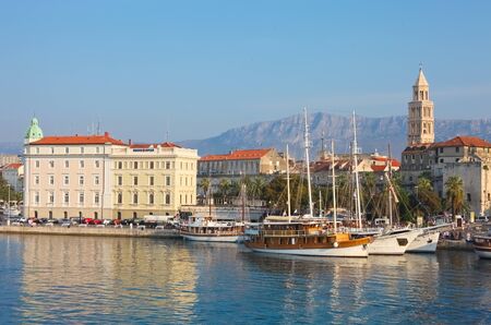 SPLIT - SEPTEMBER 24: Boats in harbour and bell tower on September 24, 2011 in Split, Croatia. The bell tower was originally built in 1100 AD.のeditorial素材
