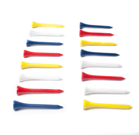 Row of colourful golfiing tees isolated on white backgroundの写真素材