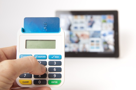 Hand held token illustrating secure mobile internet bankingの写真素材