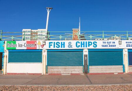 BRIGHTON, UK - FEBRUARY 8, 2011: Closed fish and chips shop on February 8, 2011 in Brighton, UK. Stores are closed over the winter there are few tourists.のeditorial素材