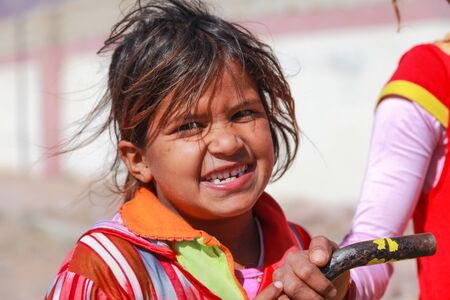 DAHAB, EGYPT - FEBRUARY 2, 2011: Portrait of young kid on the street on February 2, 2011 in Dahab, Egypt. There's no children's playground and the kids play on the road.のeditorial素材