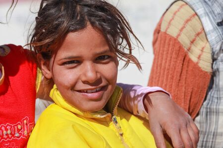 DAHAB, EGYPT - FEBRUARY 2, 2011: Portrait of young kid on the street on February 2, 2011 in Dahab, Egypt. There's no children's playground and the kids play on the road.のeditorial素材