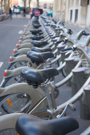 PARIS, FRANCE - JANUARY 6, 2012: Velib bucycles in the row on January 6, 2012 in Paris, France. is a large-scale public bicycle sharing system in Paris, France.のeditorial素材