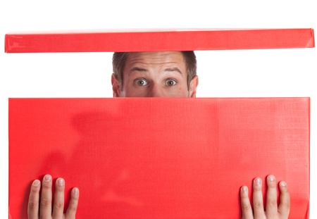 Surprised man with head in red boxの写真素材