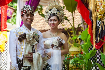 BALI - FEBRUARY 11. Couple enacting wedding scene in preparation for religious ceremony on February 11, 2012 in Bali, Indonesia. Most Balinese get married in their early 20s.のeditorial素材