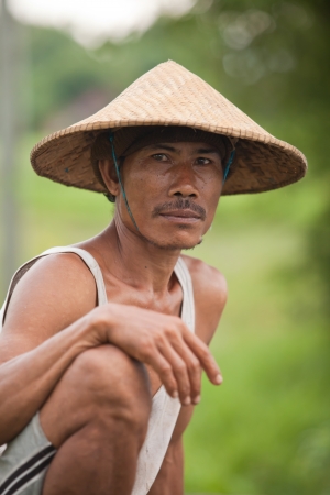 BALI - JANUARY 29. Portrait of traditional rice farmer on January 29, 2012 in Bali, Indonesia. Indonesia is currently the world's third-largest producer of rice.のeditorial素材