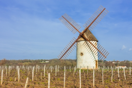 Old round traditional windmill with wooden propellers in countryside.の写真素材