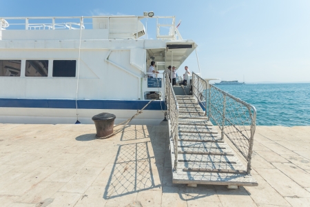 SPLIT, CROATIA - June 24, 2012: Crew members on deck resting on June 24, 2012 in Split, Croatia. With an annual turnover of 3,5 million passengers  the port of Split is the largest port in Croatia.のeditorial素材