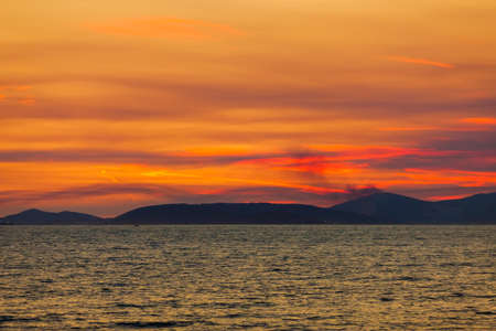 Sunset painted in red and orange colors.の写真素材