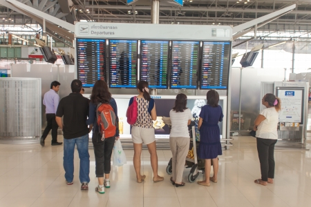 BANGKOK - MARCH 14  Passengers looking at departure display at Bangkok airport on March 14, 2012  Suvarnabhumi airport is worldのeditorial素材