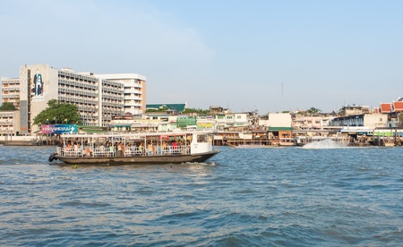 BANGKOK - MARCH 16. Public transport boat on Chao Phraya river on March 16, 2012 in Bangkok,...