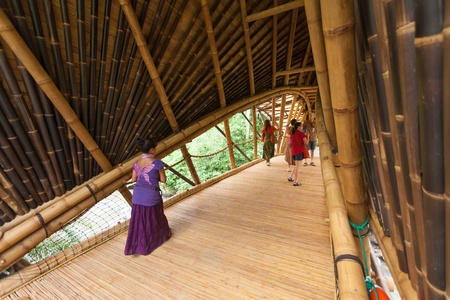 BALI, INDONESIA - FEBRUARY 2012: Bamboo bridge at Green School on Februray 27, 2012 in Bali, Indonesia. This bamboo bridge is one of a kind in the world.のeditorial素材