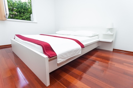 Modern and bright bedroom interior in mediterranean styleの写真素材
