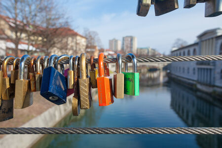 LJUBLJANA, SLOVENIA - FEB 19: Love padlocks on the Butchers Bridge on February 19, 2013 in Ljubljana, Slovenia. Each padlock symbolises the love of 2 persons  whose names are usually written on the padlock itself.のeditorial素材