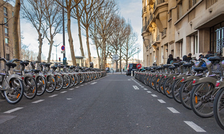 PARIS, FRANCE - JANUARY 6, 2012: Velib bicycles in the row. Velib is a large-scale public bicycle sharing system in Paris, France.のeditorial素材