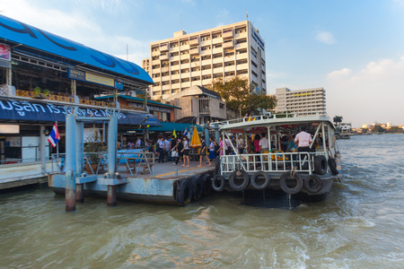 BANGKOK, THAILAND - JANUARY 10, 2012: Tourists leaving the Khlong Saen Saep water bus. It serves over 50,000 passengers daily.のeditorial素材