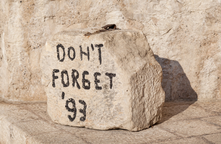 Closeup shot of "Don't Forget" stone located near the Old Bridge in Mostar, Bosnia and Herzegovina.のeditorial素材