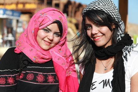 DAHAB, EGYPT - JANUARY 30, 2011: Portrait of modern young Egyptian girls woman wearing hijab, traditional head cover or wrap worn by Muslim women.のeditorial素材