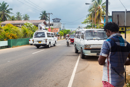 HIKKADUWA, SRI LANKA - FEBRUARY 20, 2014: Busy street in Hikkaduwa, a well known tourist international destination for board surfing.のeditorial素材