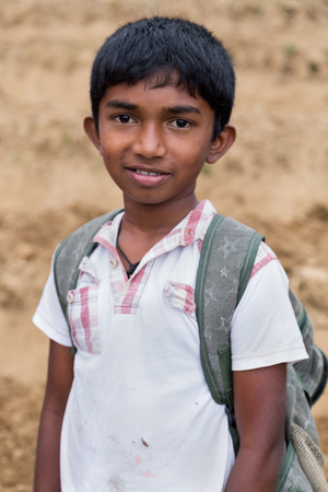 ELLA, SRI LANKA - MARCH 2, 2014: Portrait of local boy posing on tea plantation. Ella is famous for the tea plantations and stunning views across the countryside.のeditorial素材