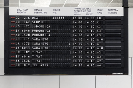BELGRADE, SERBIA - FEBRUARY 18, 2014: Flight information display at Belgrade airport Nikola Tesla, the fastest growing major airport in Europe.のeditorial素材