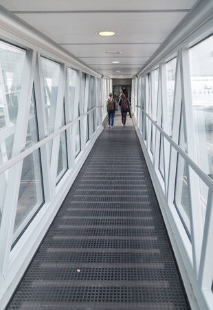BELGRADE, SERBIA - FEBRUARY 18, 2014: Passengers  boarding plane at Belgrade airport Nikola Tesla, the fastest growing major airport in Europe.のeditorial素材