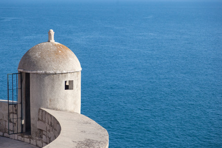 Gun turret on old city walls of Dubrovnik (Croatia) with Adriatic sea in background. 