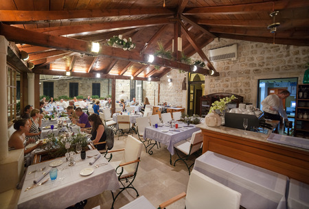 DUBROVNIK, CROATIA - MAY 27, 2014: Guests having dinner at restaurant's terrace. Dubrovnik has many restaurants which offer traditional Dalmatian cuisine and some great wine lists.のeditorial素材