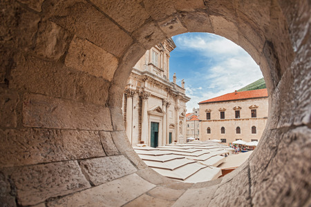 DUBROVNIK, CROATIA - MAY 26, 2014: View on The Assumption Cathedral entrance through circular stone opening. Cathedral is the seat of the Roman Catholic Diocese of Dubrovnik.のeditorial素材