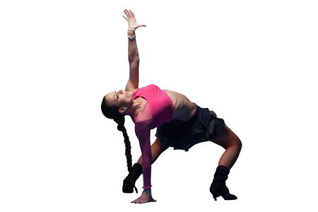 Young attractive female dancer posing against clear white background.