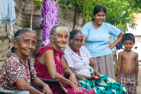 WELIGAMA, SRI LANKA - MARCH 8, 2014: Local women and boy street posing on street. Local people in Sri Lanka are very friendly to tourists.のeditorial素材