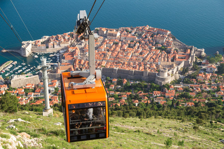 DUBROVNIK, CROATIA - MAY 26, 2014: Tourists at Cable car which connects Ploce and  mountain Srdj above town where you can enjoy a panoramic view of Old Town and the surrounding islands.のeditorial素材