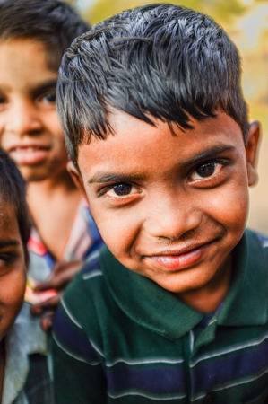 HAMPI, INDIA - 31 JANUARY 2015: Indian boy with friends in backgroundのeditorial素材