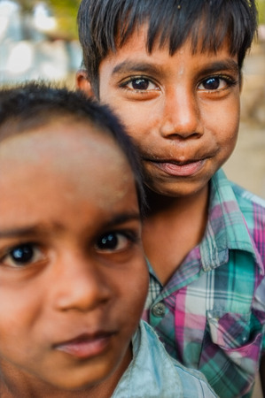 HAMPI, INDIA - 31 JANUARY 2015: Two Indian boys on street in neighbourhood