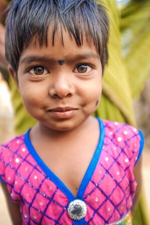 HAMPI, INDIA - 31 JANUARY 2015: Cute little Indian girl with bindi in dress on streetのeditorial素材