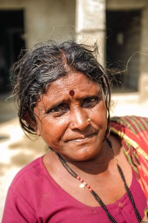 HAMPI, INDIA - 01 FEBRUARY 2015: Indian middle-aged woman with bindi on street infront of homeのeditorial素材