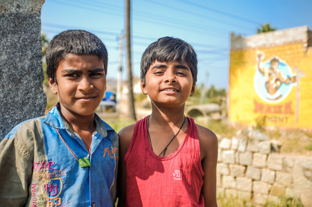 HAMPI, INDIA - 01 FEBRUARY 2015: Two Indian boys in street on a sunny dayのeditorial素材