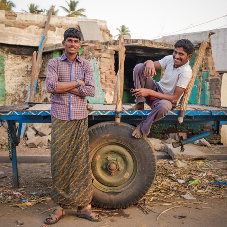 KAMALAPURAM, INDIA - 02 FABRUARY 2015: Indian men relaxing on trailerのeditorial素材