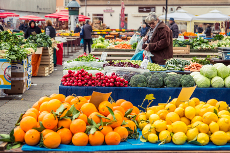 ZAGREB, CROATIA - 12 MARCH 2015: Dolac market full of fruits and vegetables with a view of Zagreb Cathedral.のeditorial素材